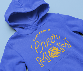 image of cheerleading apparel design heat transfer with words "Carterville Cheer Mom" in yellow on blue hoodie