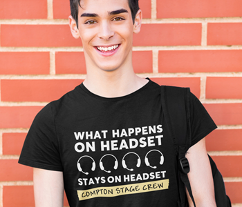 man with black t shirt with stage crew drama/theatre design on it