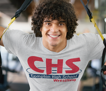 man wearing white t shirt with CHS compton high school wrestling on it